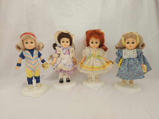 Vogue Ginny Dolls with Outfits & Stands - Lot of 4