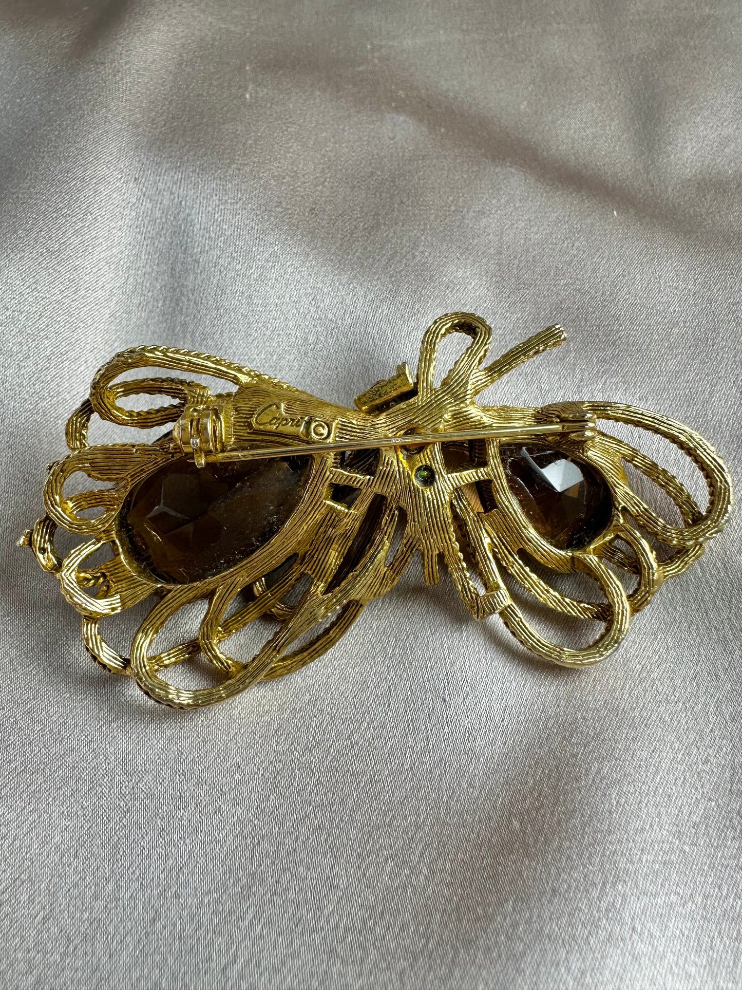 Vintage CAPRI Gold tone Brown Green Stones Rhinestone Bow Brooch Pin - 2.75"