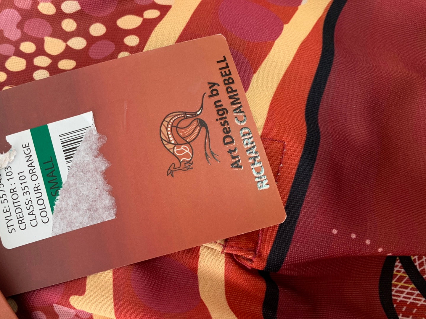 NWT - GUMARAA ABORIGINAL EXPERIENCE red print Indigenous 3 Totems Polo Shirt - Small