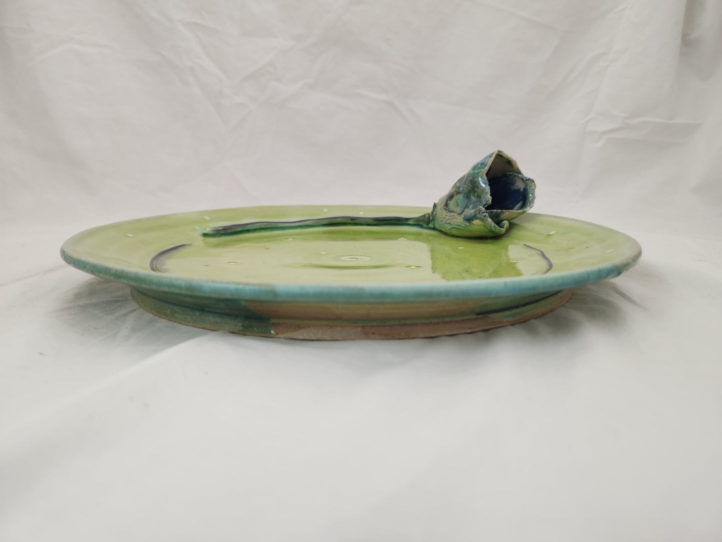 Arona ~ Wheel Thrown Pottery Green Glazed Wall Plate with Tulip Flower